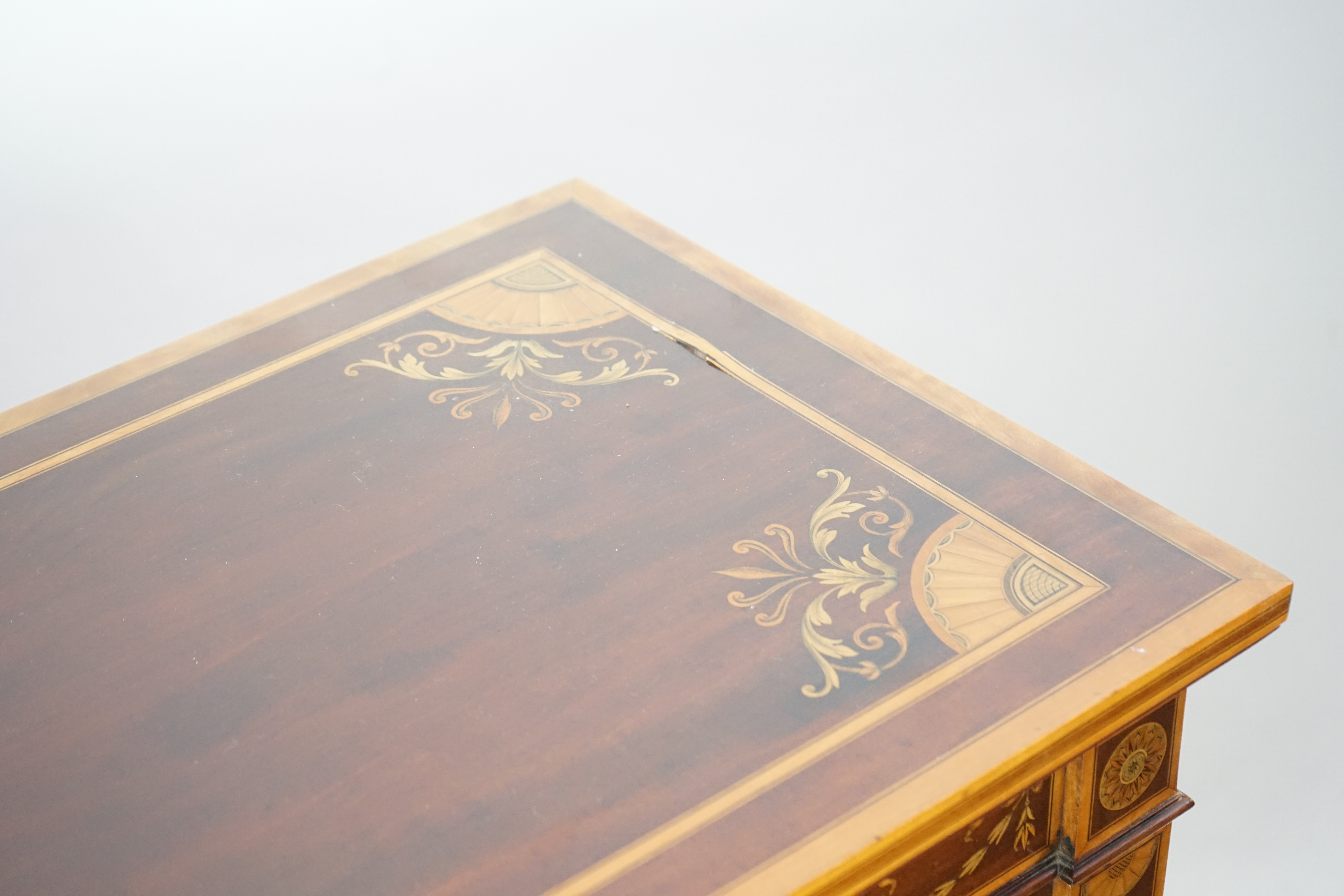 A pair of Edwardian marquetry inlaid and satinwood banded mahogany side cabinets, by Gillows